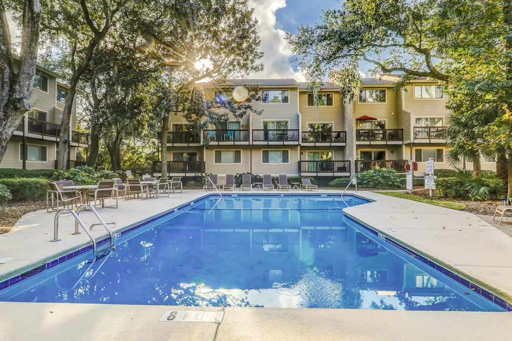 Second Floor Condo Steps to Coligny with Shared Pool, Central AC, & Beach Access