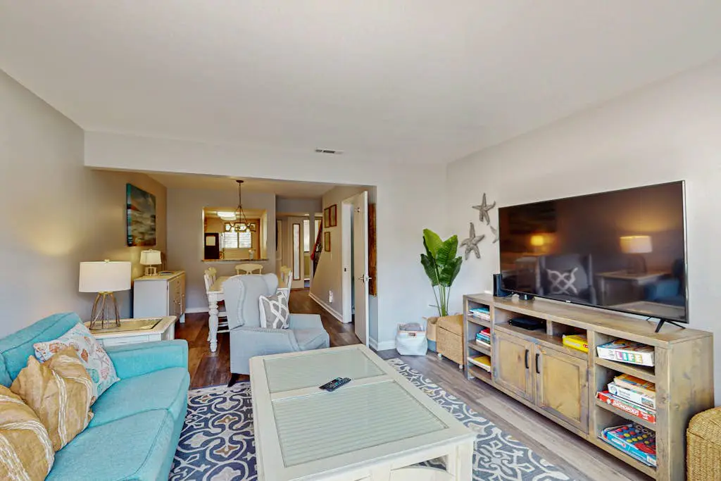 Second Floor Condo Steps to Coligny with Shared Pool, Central AC, & Beach Access
