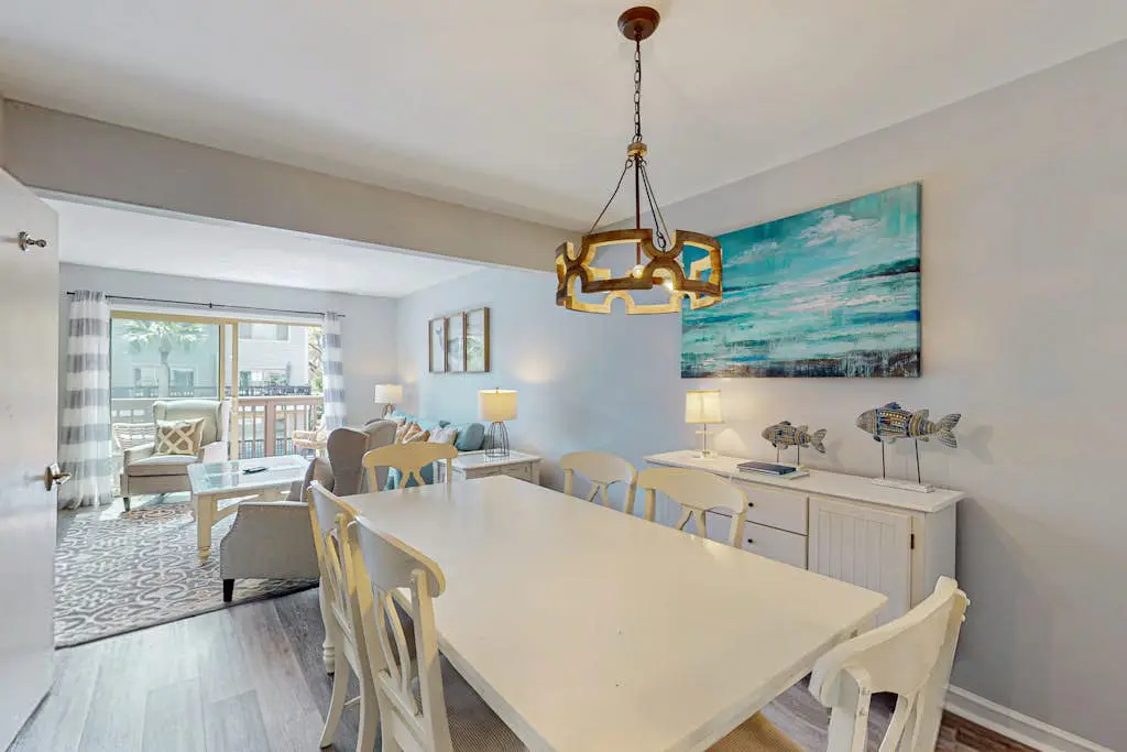 Second Floor Condo Steps to Coligny with Shared Pool, Central AC, & Beach Access