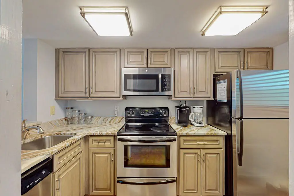 Second Floor Condo Steps to Coligny with Shared Pool, Central AC, & Beach Access