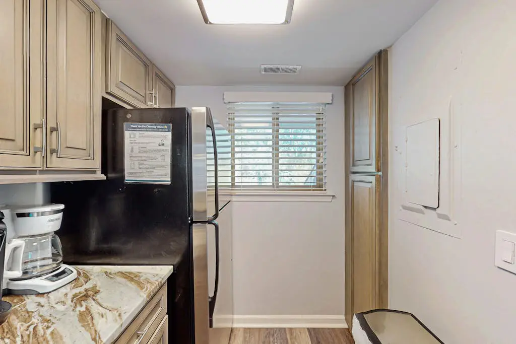 Second Floor Condo Steps to Coligny with Shared Pool, Central AC, & Beach Access