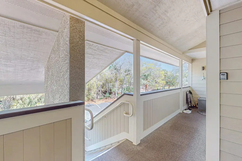 Second Floor Condo Steps to Coligny with Shared Pool, Central AC, & Beach Access