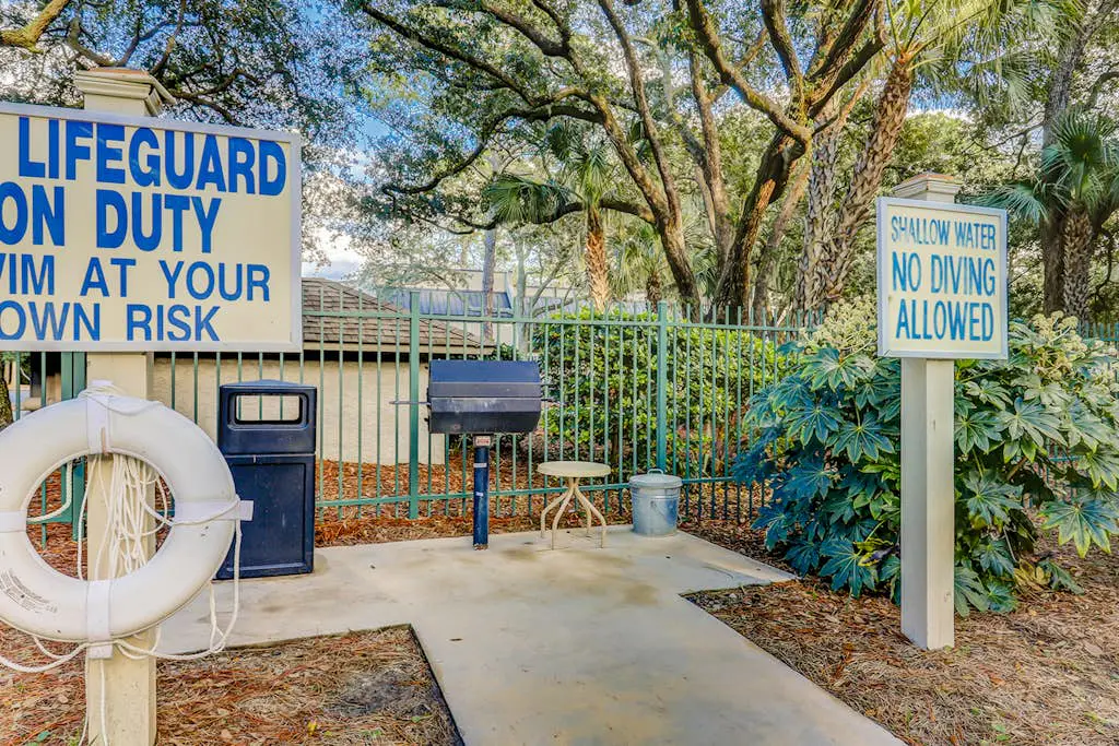 Second Floor Condo Steps to Coligny with Shared Pool, Central AC, & Beach Access