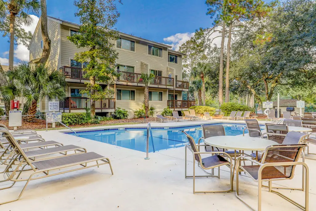 Second Floor Condo Steps to Coligny with Shared Pool, Central AC, & Beach Access