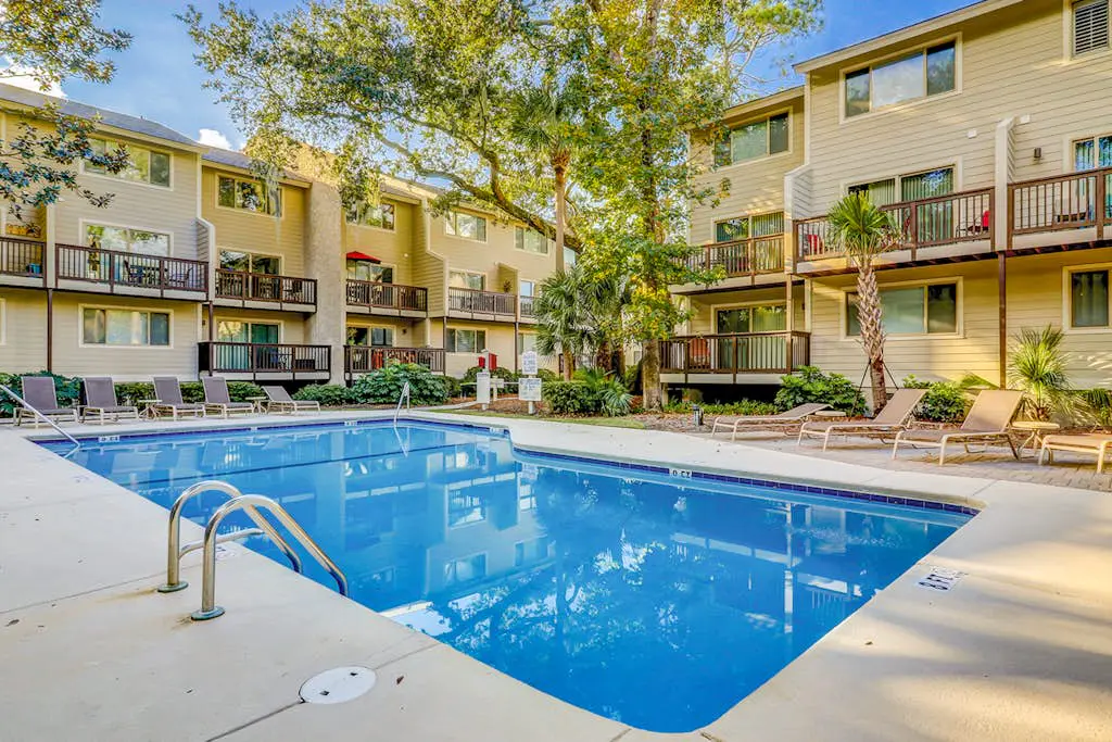 Second Floor Condo Steps to Coligny with Shared Pool, Central AC, & Beach Access
