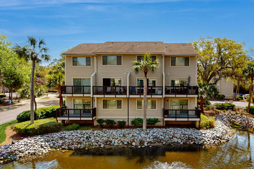 Second Floor Condo Steps to Coligny with Shared Pool, Central AC, & Beach Access