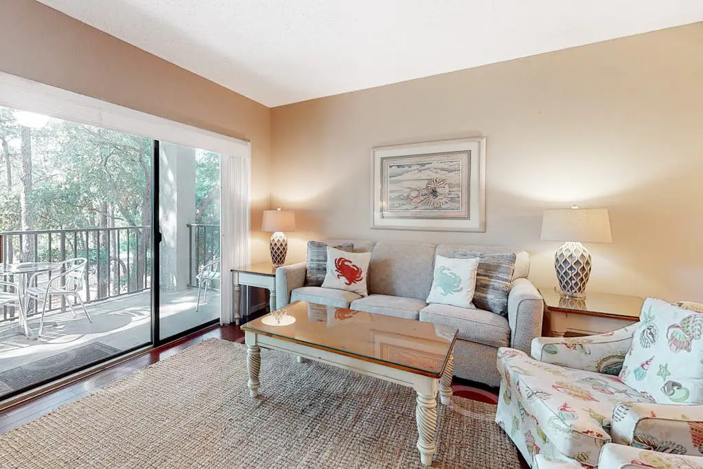 Second-floor condo with balcony, shared outdoor pool, central AC