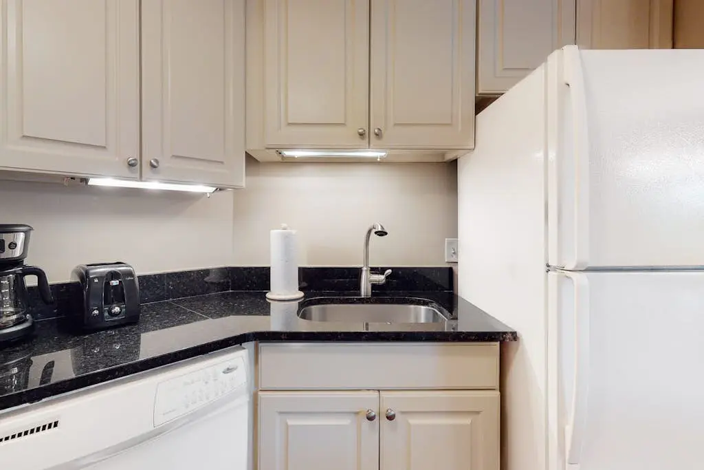 Second-floor condo with balcony, shared outdoor pool, central AC