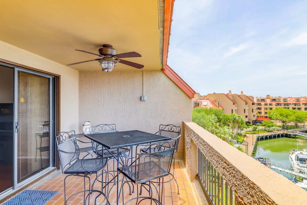 Penthouse living at Shelter Cove Marina with balcony, harbor view, pool & tennis