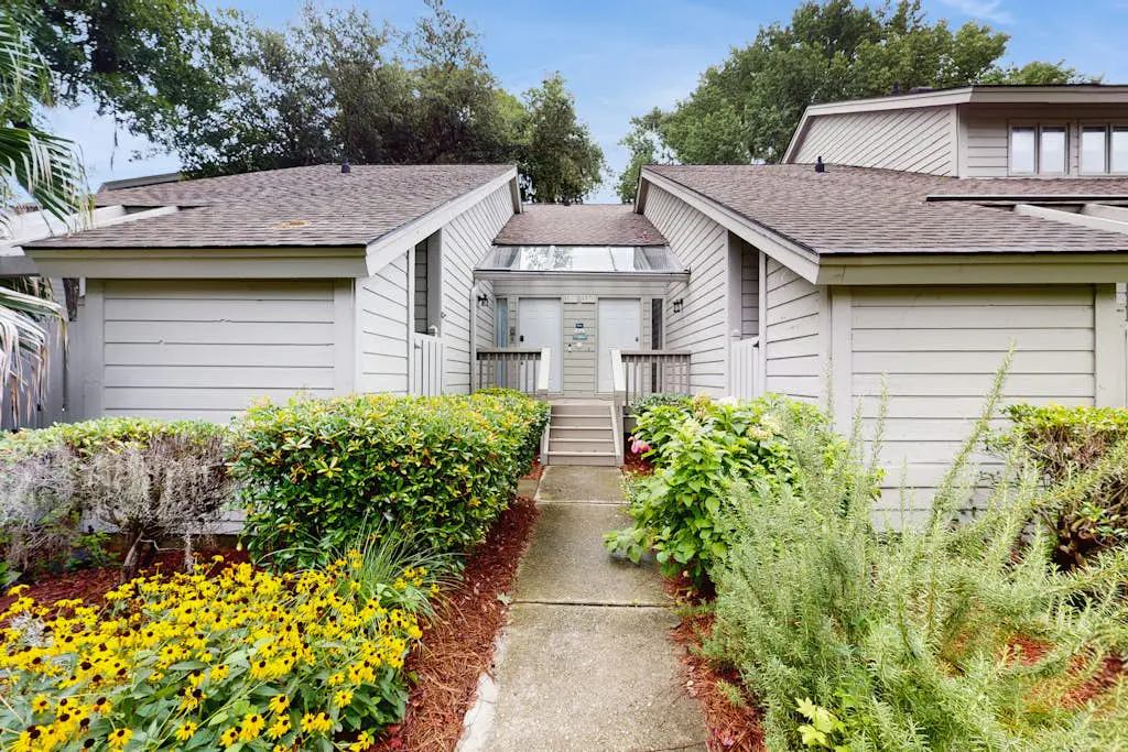 Villa with saltwater pool, golf, firepit, hot tub, & private beach access