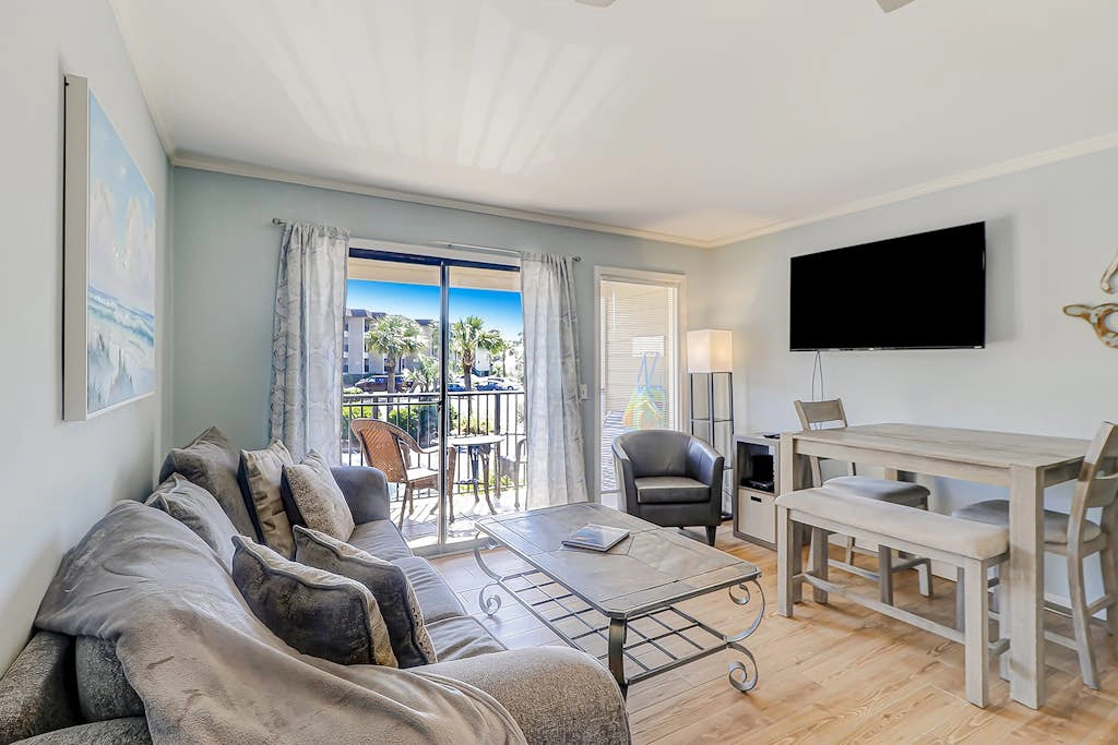 Renovated condo on the beach with pool, balcony, central AC, W/D, & fitness room