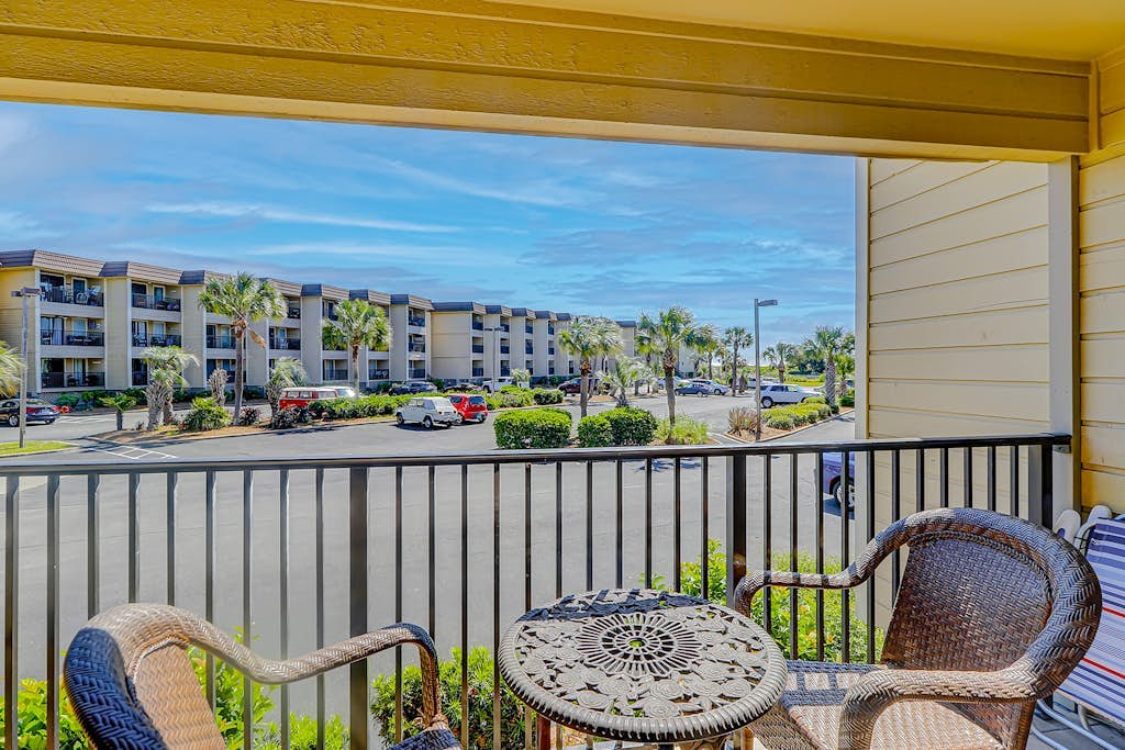 Renovated condo on the beach with pool, balcony, central AC, W/D, & fitness room