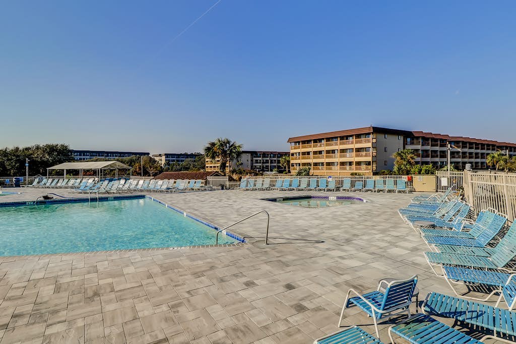 Renovated condo on the beach with pool, balcony, central AC, W/D, & fitness room