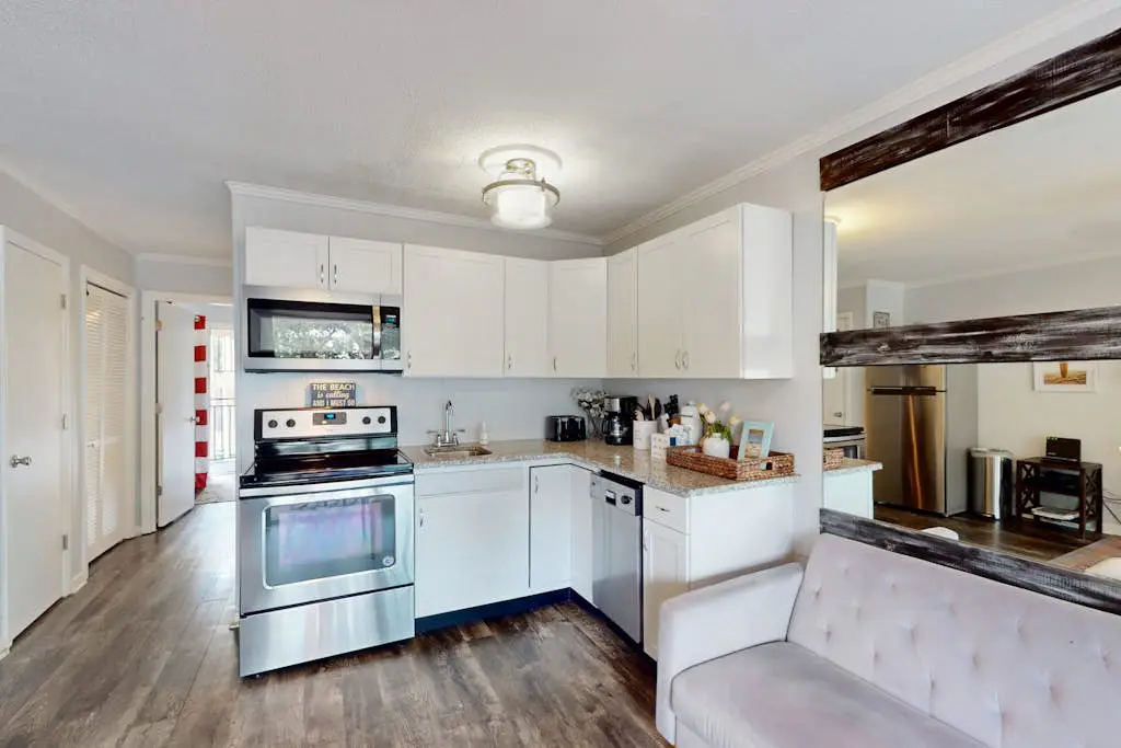 Updated Condo with Fast WiFi, Shared Pool, Balcony & Central AC - Walk to Beach