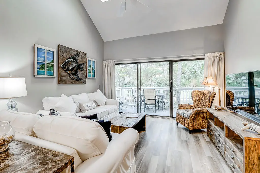 Sun-kissed bliss at Colonnade Club with dual suites, deck, shared pool, hot tub