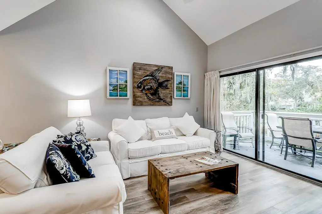 Sun-kissed bliss at Colonnade Club with dual suites, deck, shared pool, hot tub