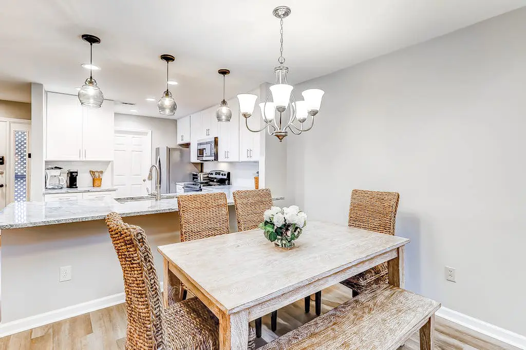 Sun-kissed bliss at Colonnade Club with dual suites, deck, shared pool, hot tub