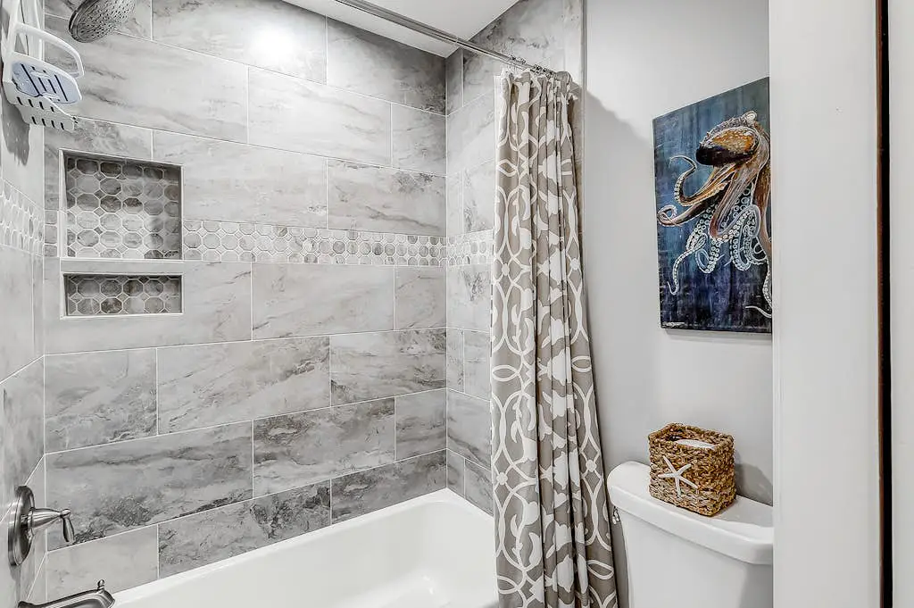 Sun-kissed bliss at Colonnade Club with dual suites, deck, shared pool, hot tub