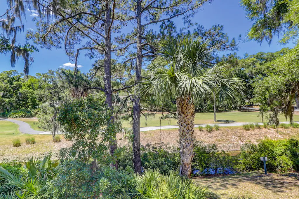 Sun-kissed bliss at Colonnade Club with dual suites, deck, shared pool, hot tub