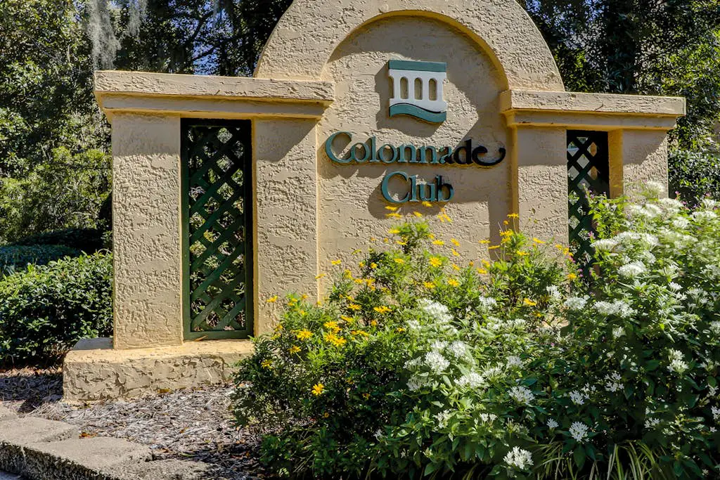Sun-kissed bliss at Colonnade Club with dual suites, deck, shared pool, hot tub