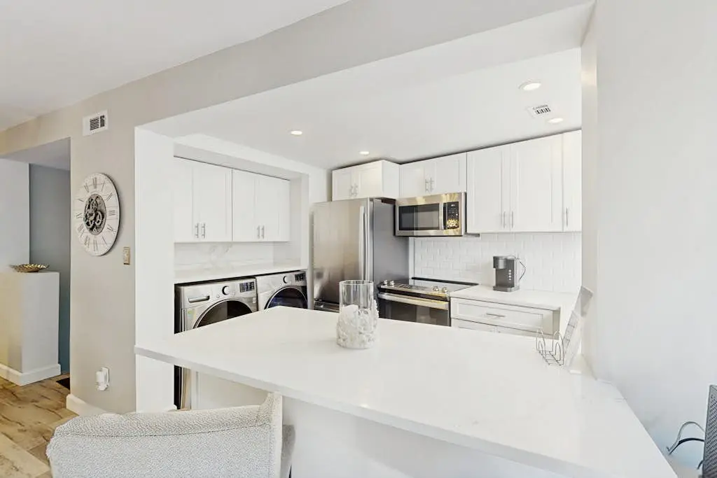 Renovated lagoon view villa with balcony, WiFi, shared pools, & beach access