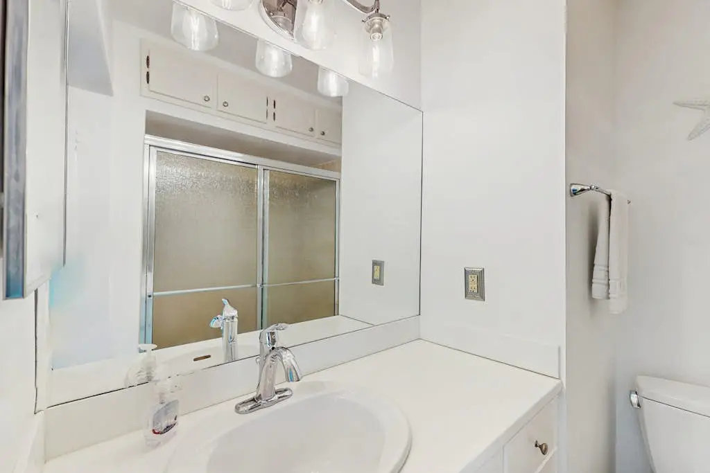 Renovated lagoon view villa with balcony, WiFi, shared pools, & beach access