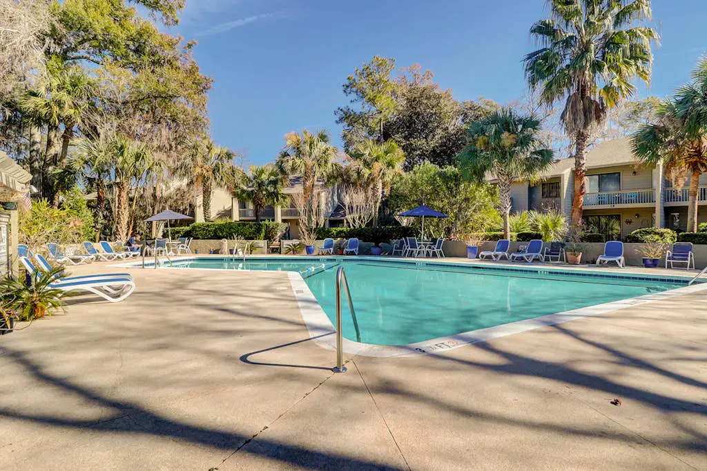     Relaxing Coastal Escape- Golf course view with shared pool, nearby beach access, and serene island charm