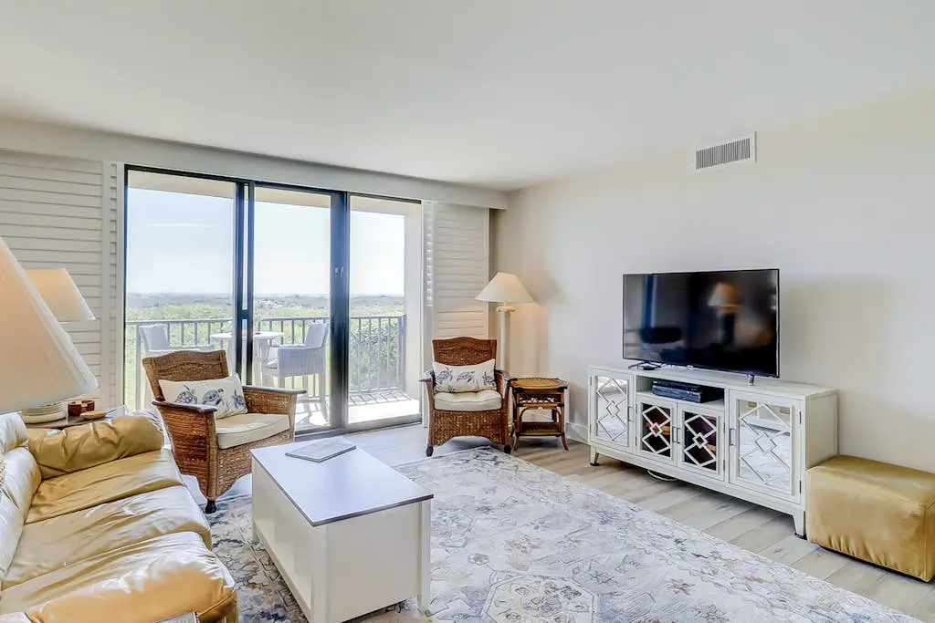 Beachfront escape with pools, hot tub, WiFi, washer dryer, & central AC