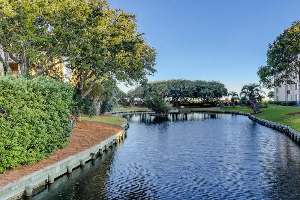 Beachfront escape with pools, hot tub, WiFi, washer dryer, & central AC