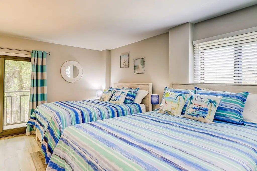 4th-floor villa with balcony, beach access, outdoor pool, & grills