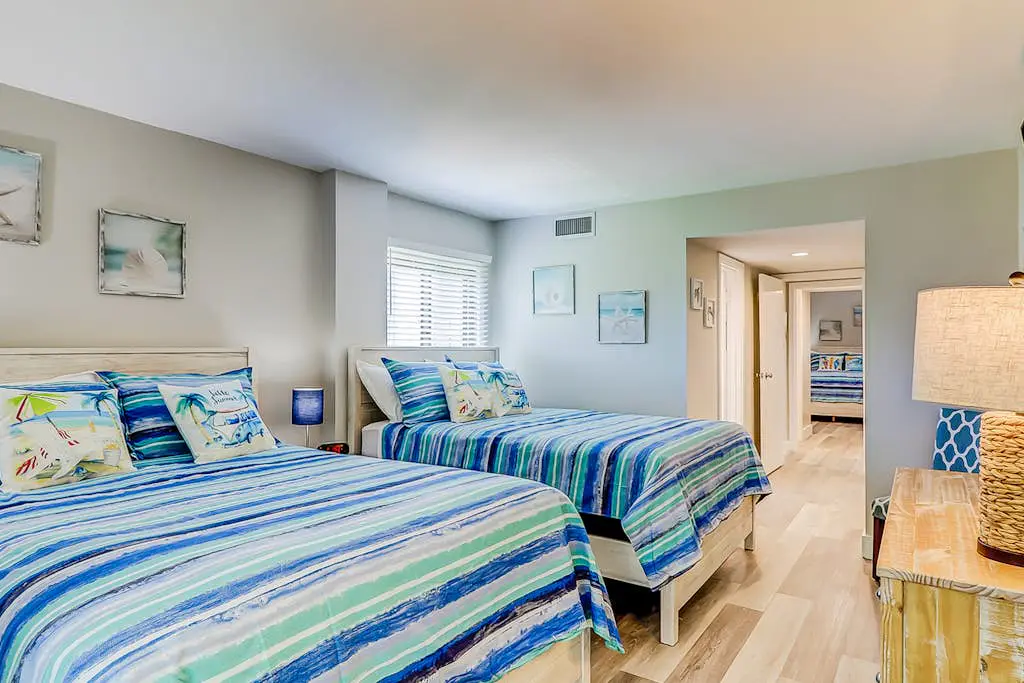 4th-floor villa with balcony, beach access, outdoor pool, & grills