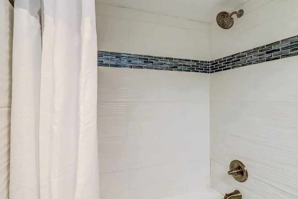 4th-floor villa with balcony, beach access, outdoor pool, & grills