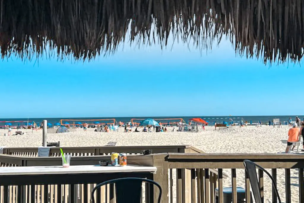 4th-floor villa with balcony, beach access, outdoor pool, & grills