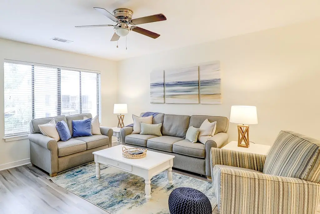 Ideally located island gem with an outdoor pool, full kitchen, & balcony