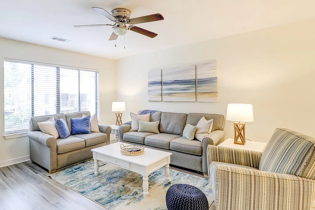 Ideally located island gem with an outdoor pool, full kitchen, & balcony