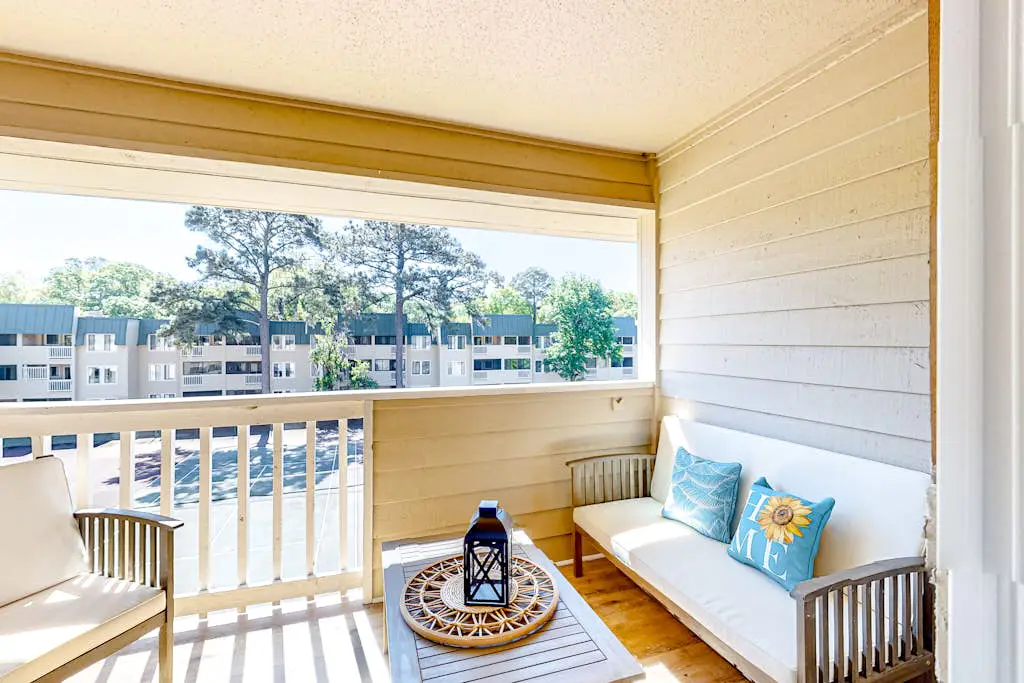 Vibrant condo with tennis courts, pool, W/D, gas grill, balcony, & playground