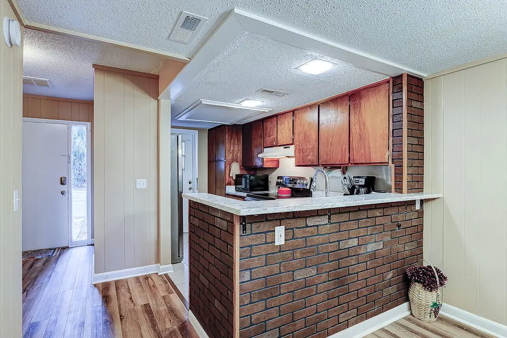 2-story condo with pool, private patio, & grill - walk to beach - near Coligny