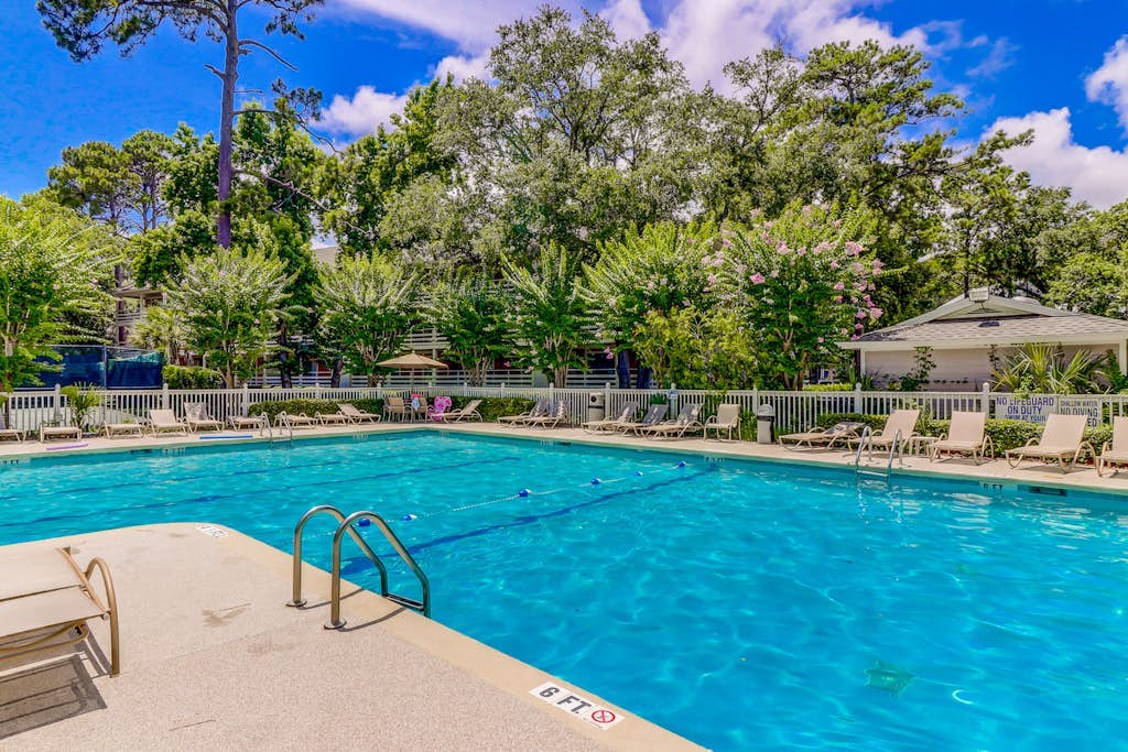 End-unit, 3rd-floor condo near beach with balcony, pool, & tennis