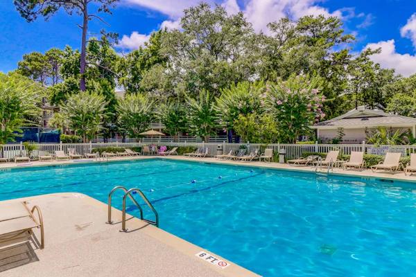 End-unit, 3rd-floor condo near beach with balcony, pool, & tennis