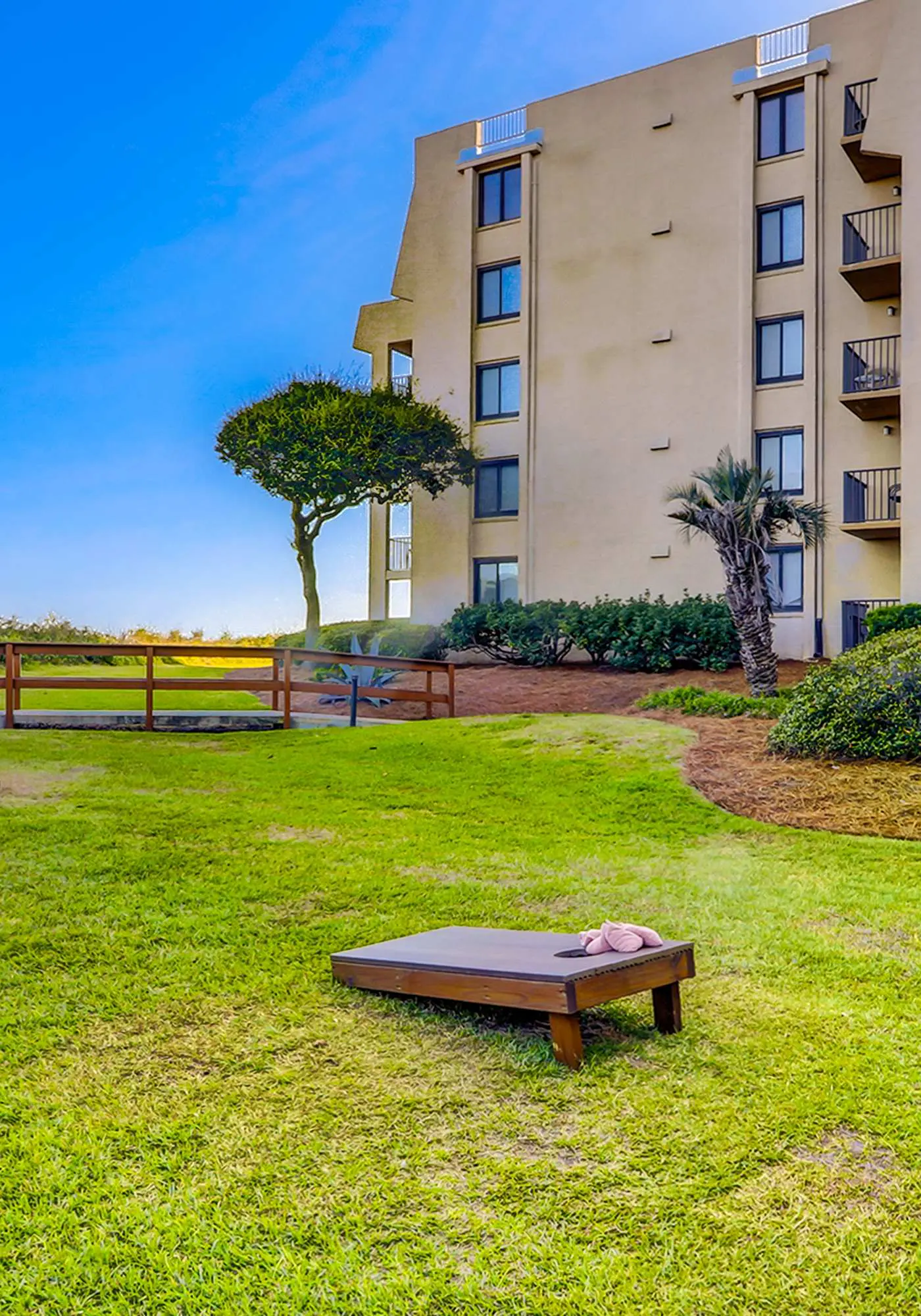 Top-floor condo with ocean views, on-site pools, beach access, & sports courts