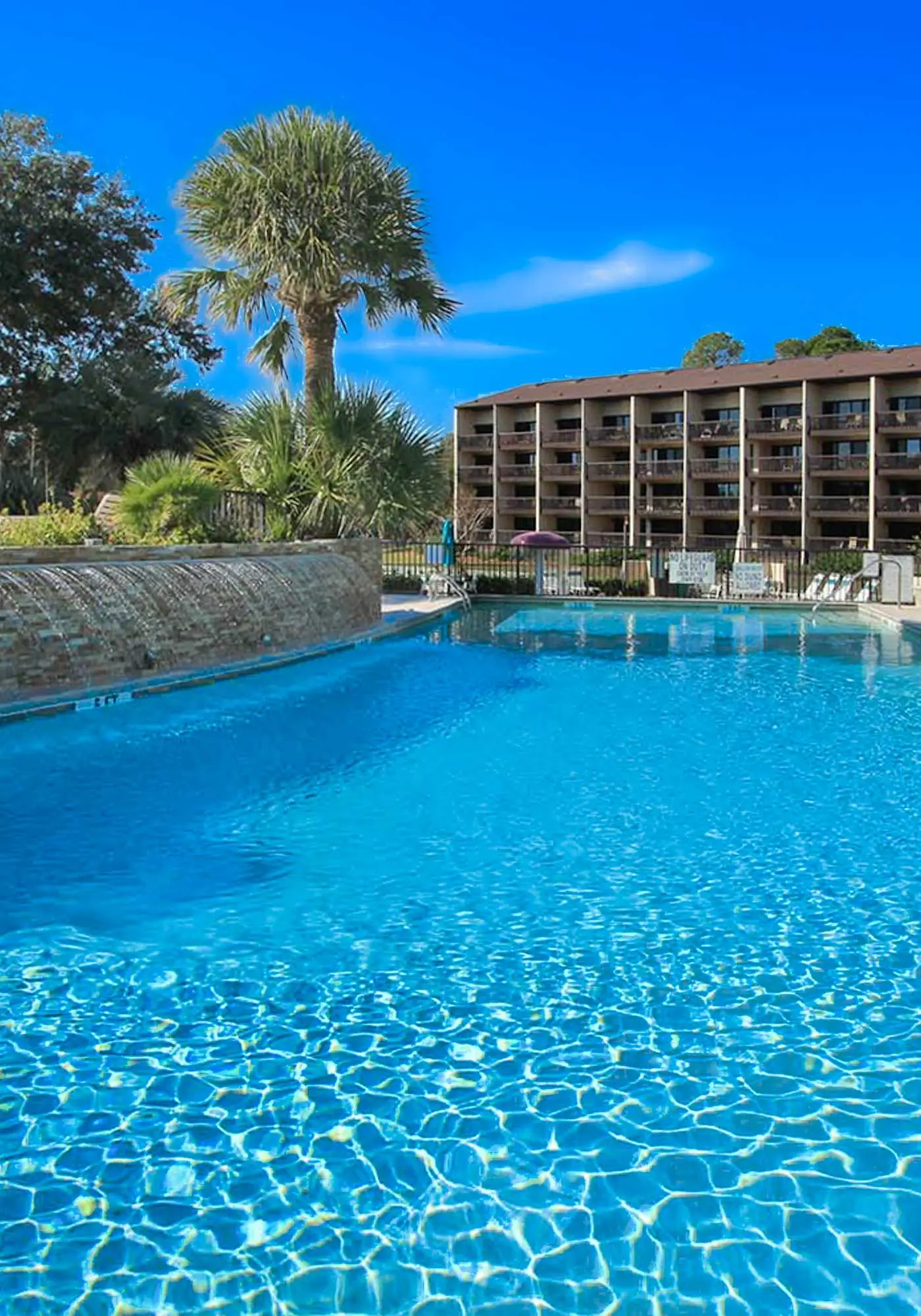 Top-floor condo with ocean views, on-site pools, beach access, & sports courts