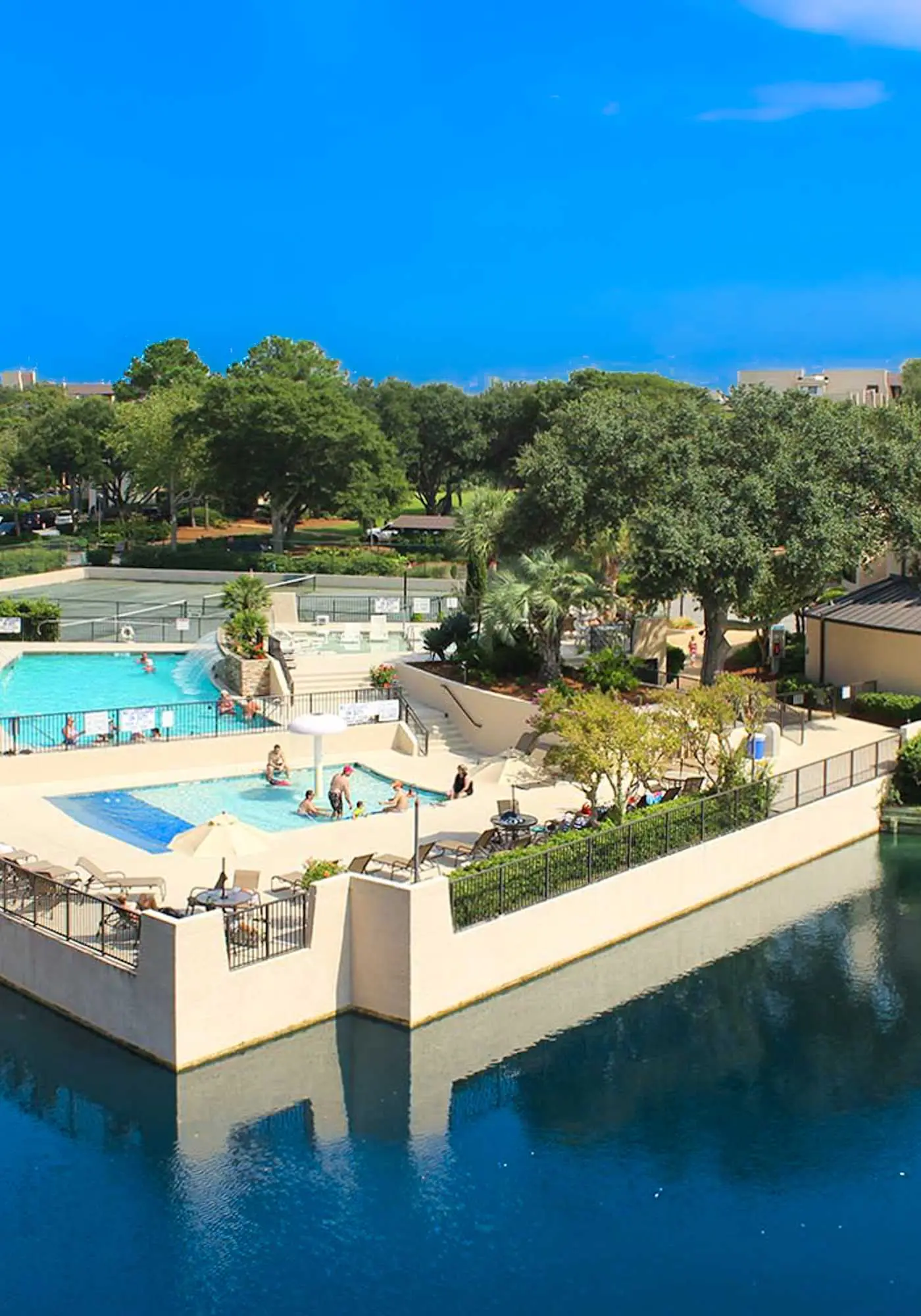 Top-floor condo with ocean views, on-site pools, beach access, & sports courts