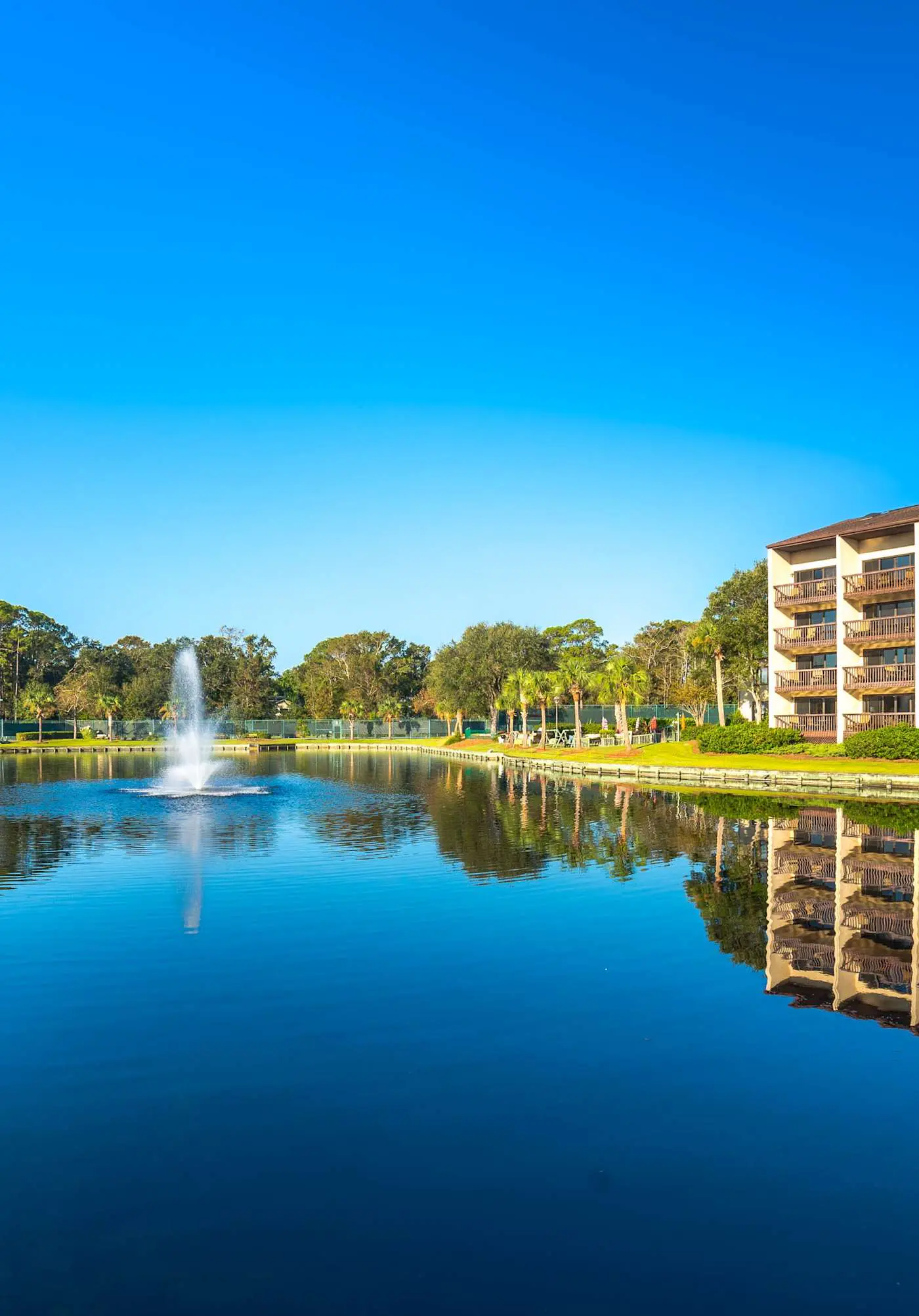 Top-floor condo with ocean views, on-site pools, beach access, & sports courts