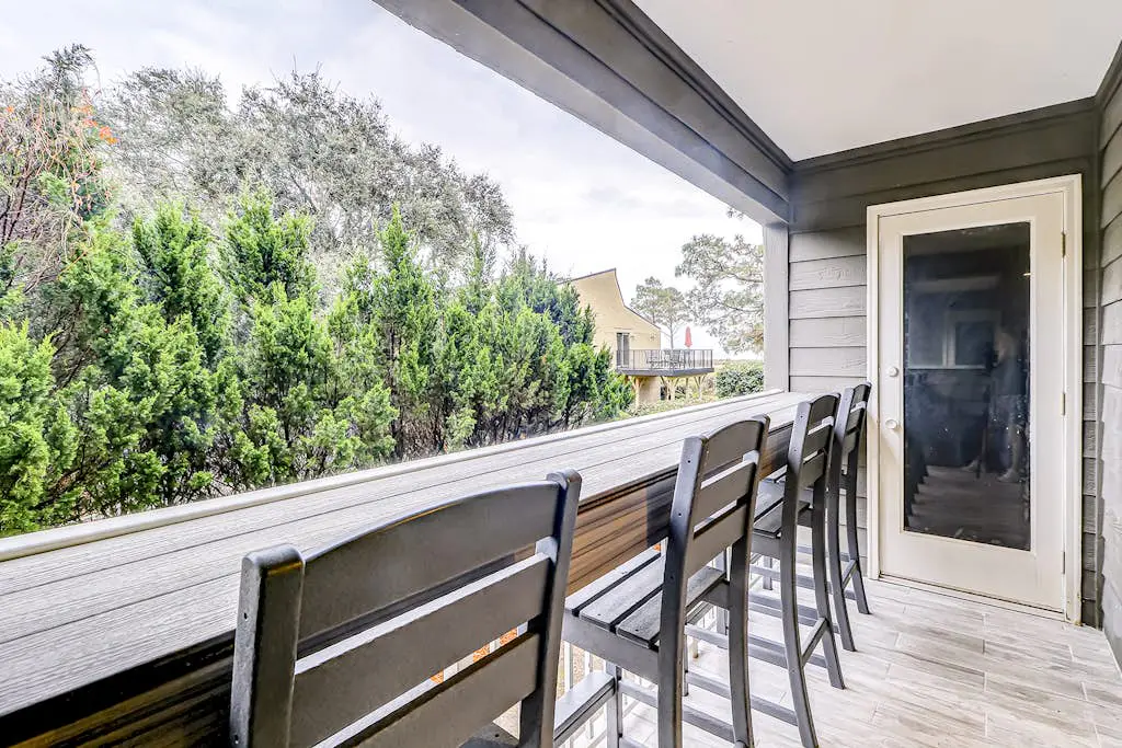 Modern condo with water views, central air-conditioning, shared pool, & hot tub
