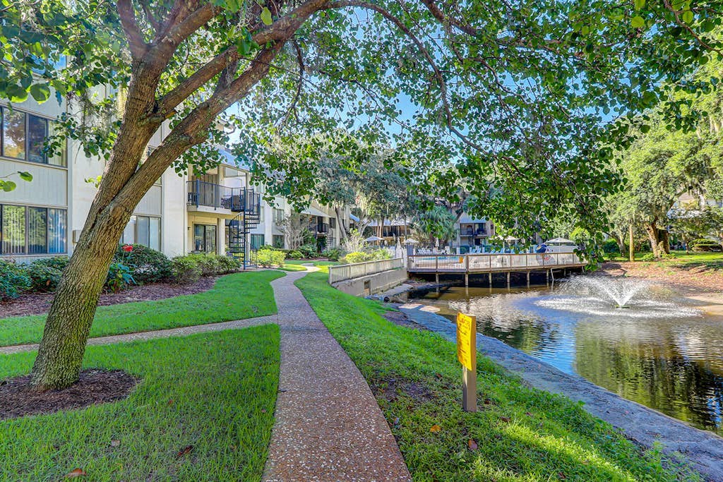 Relaxing condo with tennis court, pool, balcony, patio, kitchen, W/D, & kitchen