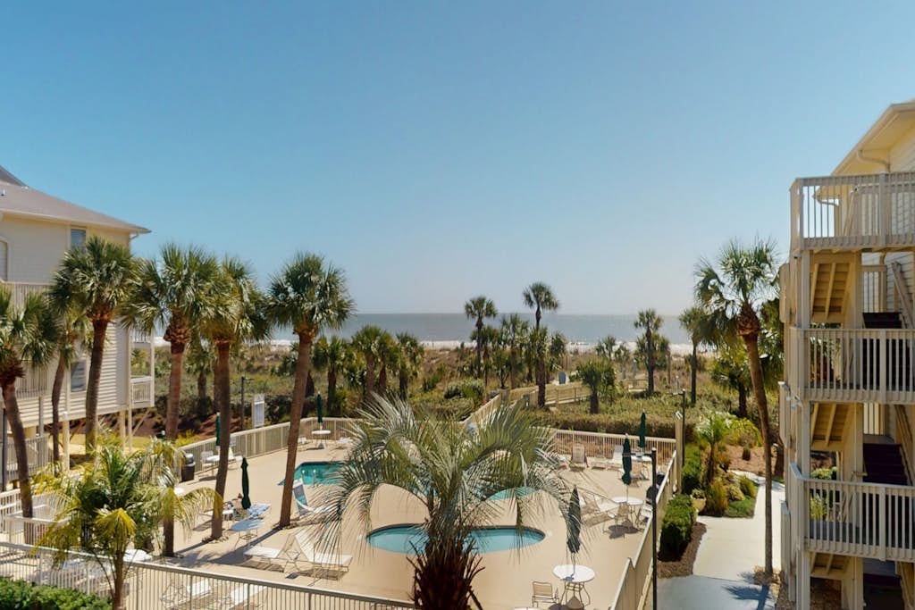 Beach-view condo in oceanfront complex with outdoor pool, beach access & balcony