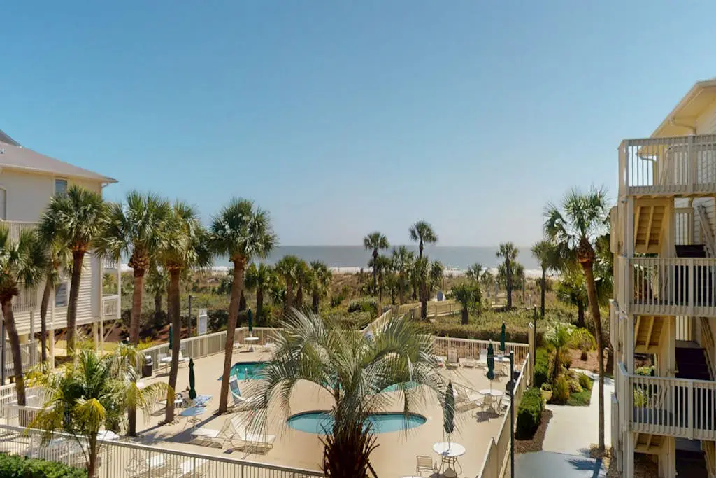 Beach-view condo in oceanfront complex with outdoor pool, beach access & balcony