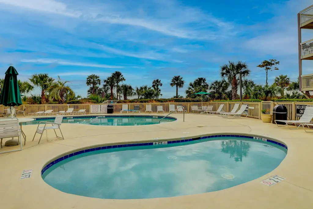 Beach-view condo in oceanfront complex with outdoor pool, beach access & balcony