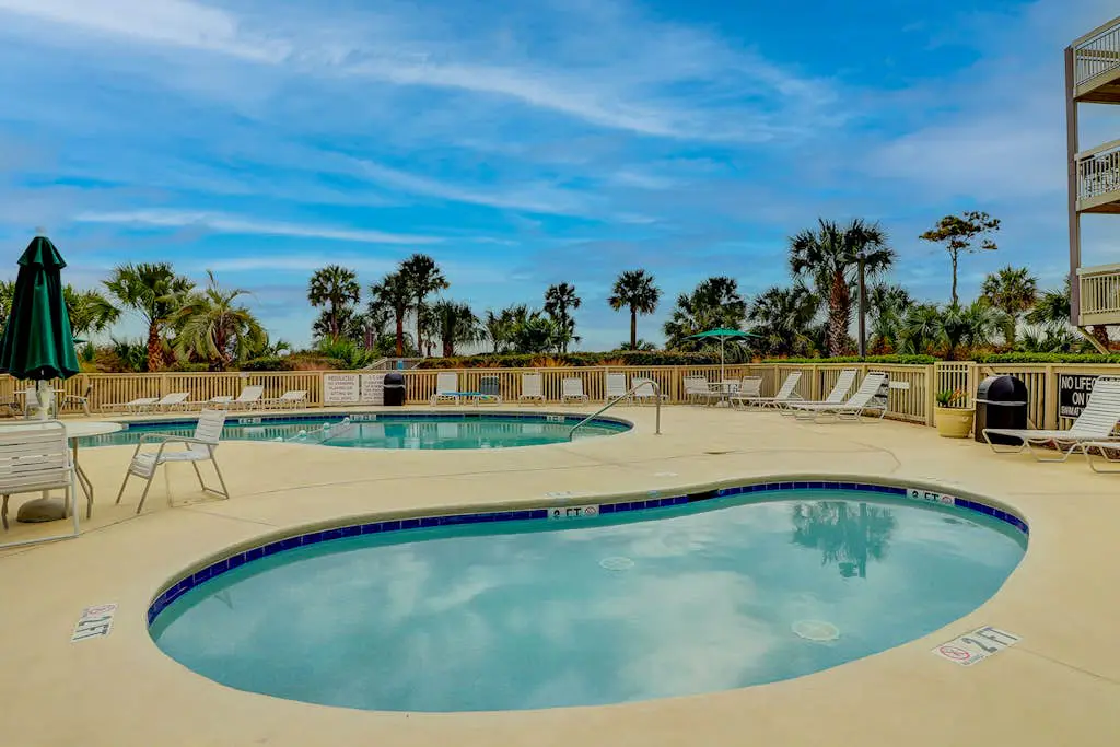 Beach-view condo in oceanfront complex with outdoor pool, beach access & balcony
