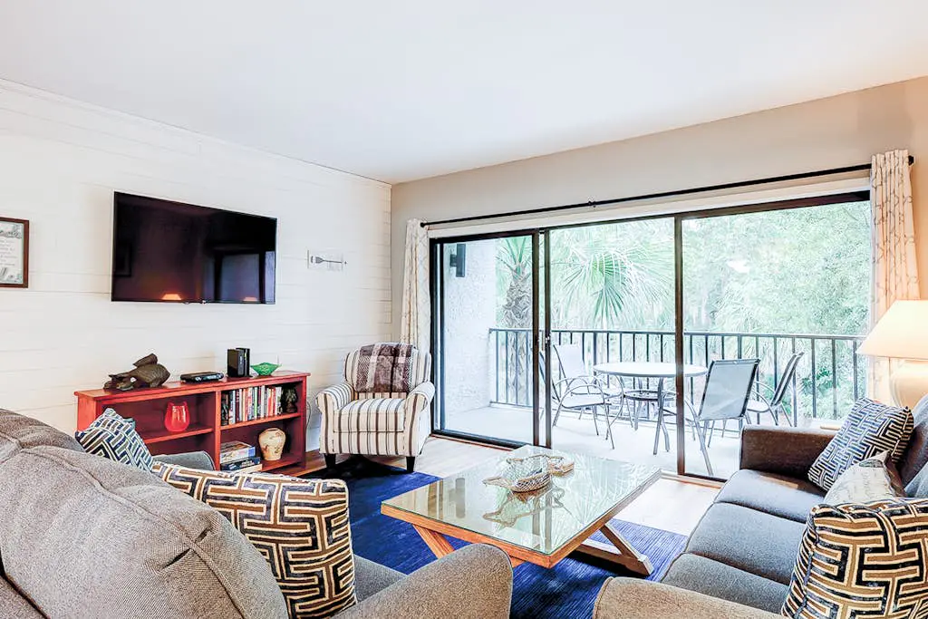 Family-friendly condo near the beach with balcony, central AC, & shared pool